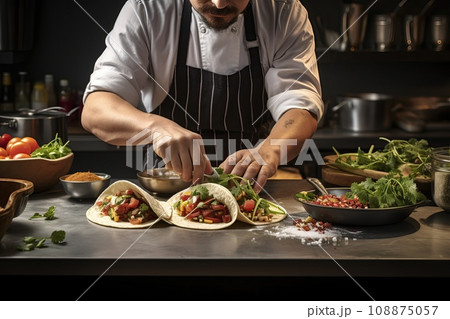 Chef assembling a gourmet taco with unique ingredients, capturing the precision and artistry of taco creation Chef assembling a gourmet taco with unique ingredients, capturing the precision and artistry of taco creation 108875057