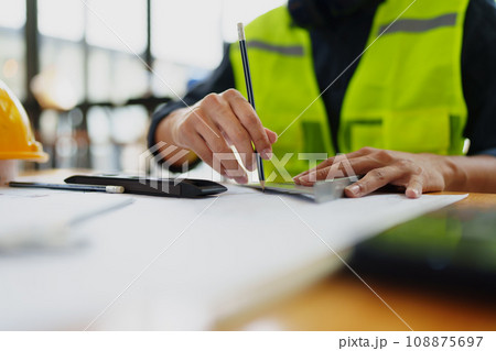 Engineers, designers and interior designers are finalizing the design of interiors by discussing selecting materials and colors to design rooms to present to clients 108875697