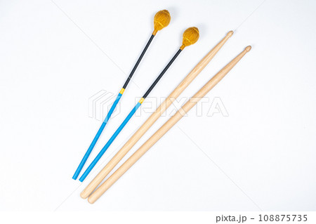 Xylophone and drum sticks on white background top view 108875735