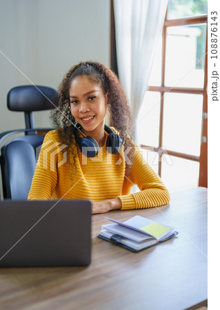 Portrait of African Americans using notebooks, pens to take notes and computers. to study through the Internet, online e learning concept 108876143