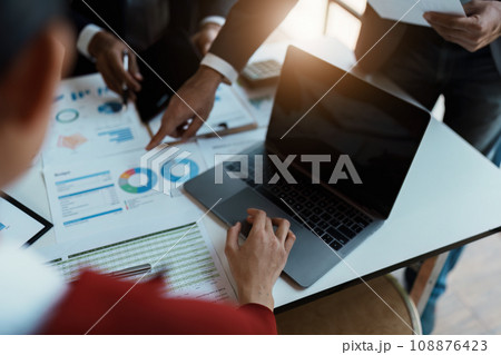 Team business adviser meeting to analyze and discuss the situation on the financial report n the meeting room with using computer laptop, tablet, calculator, documents in work 108876423