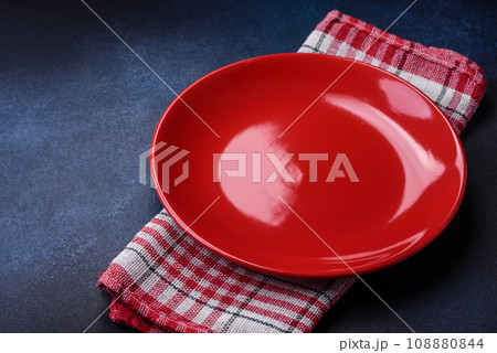 Round empty colored ceramic plate on concrete texture background 108880844