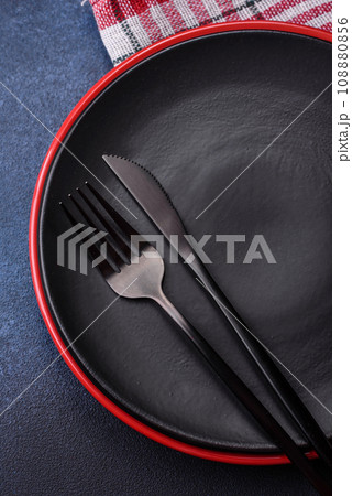Round empty colored ceramic plate on concrete texture background Round empty colored ceramic plate on concrete texture background 108880856