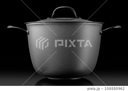 Stainless steel cooker with lid and chrome cookware on black background 108880962