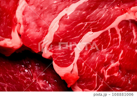 Macro closeup view of a red piece of veal meat on table. Slices of beef steak with a red streaked texture 108881006