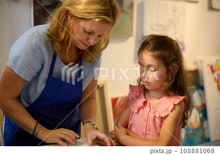 Authentic portrait of an art school student and teacher during painting lesson. Individual art-class concept 108881068