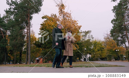 Man and woman work for same company discussing various work related matters Man and woman work for same company discussing various work related matters 108883149