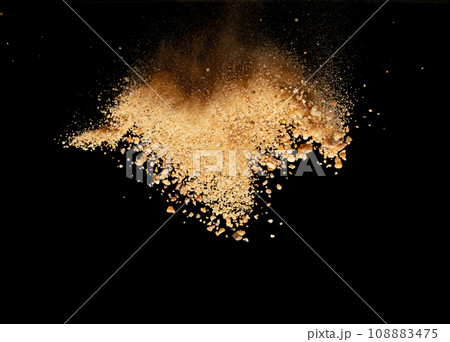 Big size Sand flying explosion, Golden grain wave explode. Abstract cloud fly. Yellow colored sand splash throwing in Air. Black background Isolated selective focus blur 108883475