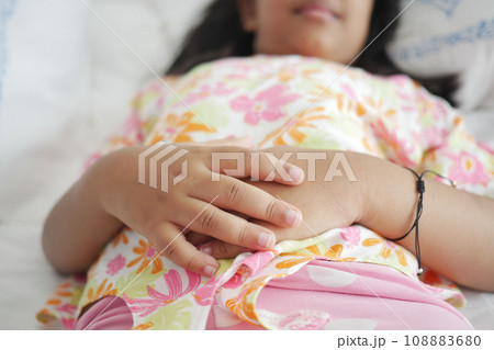 a child sleeping in bed, selective focus . a child sleeping in bed, selective focus . 108883680