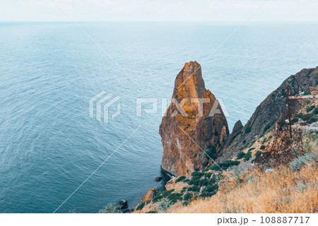 Two huge stones in the middle of the sea. Two huge stones in the middle of the sea. 108887717