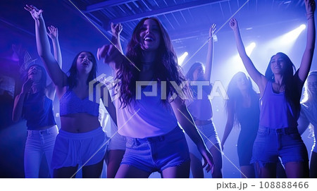 Large group of young people are dancing in a nightclub. Large group of young people are dancing in a nightclub. 108888466