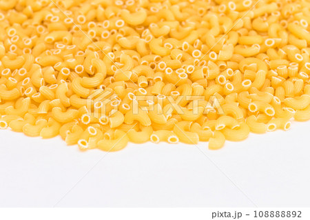 A Heap of Uncooked Chifferi Rigati Pasta on White Background A Heap of Uncooked Chifferi Rigati Pasta on White Background 108888892