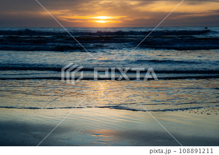 Affirmation photo You are free to be different Love yourself sunset over the sea horizon orange sky clouds dark sea water edge sand 108891211