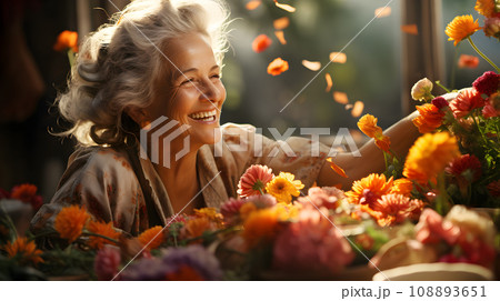 Smiling beautiful Elderly senior Caucasian gardener or Florist woman is relaxing and gardening happy in garden and flowers farm. 108893651