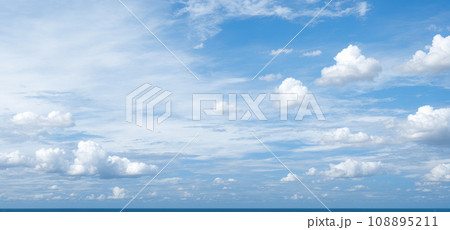 cloudscape. clouds in blue sky and reflection in sea or ocean. White cumulus clouds in sky over salt lake. mirror reflection clouds in water, sunny summer day seascape panoramic. pink sunset sunrise 108895211