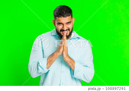 Sneaky cunning Indian young man thinking over devious villain idea, cheats, jokes, pranks, evil plan 108897291
