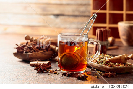 Christmas herbal tea with cinnamon, anise, and dried herbs. 108899826