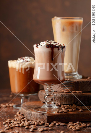 Coffee and chocolate drinks with whipped cream. 108899849