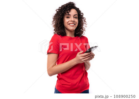 young slender leader woman with black curly shoulder-length hair dressed in a red basic t-shirt young slender leader woman with black curly shoulder-length hair dressed in a red basic t-shirt 108900250