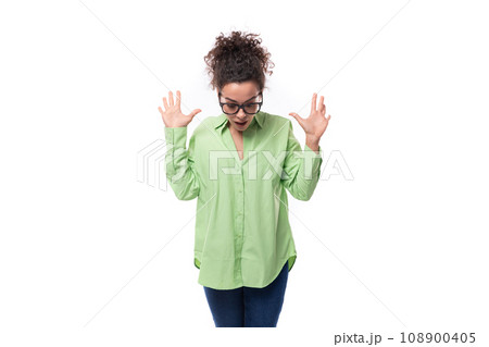 young stylish caucasian secretary woman with black curly hair in glasses and light green shirt on a 108900405