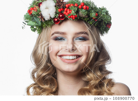 Attractive happy positive female model with long blonde curly hair and makeup posing  108900770