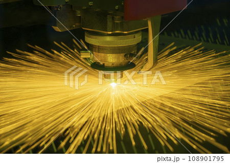 The fiber laser cutting machine cut the metal plate with the sparkling light. The fiber laser cutting machine cut the metal plate with the sparkling light. 108901795