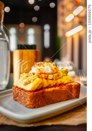 Croque Madame hot french sandwich with ham, melted cheese, fried egg and sauce. Croque Madame hot french sandwich with ham, melted cheese, fried egg and sauce. 108906076