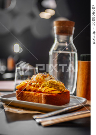 Croque Madame hot french sandwich with ham, melted cheese, fried egg and sauce. 108906087