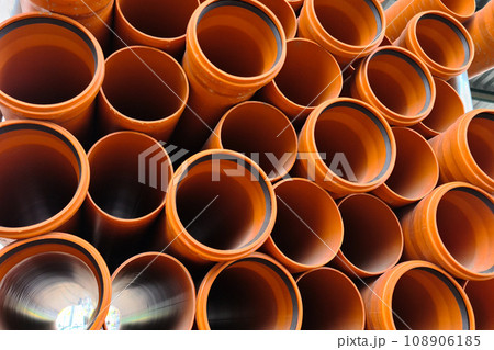 Lots of new orange sewer pipes Lots of new orange sewer pipes 108906185