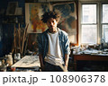 Portrait of male artist on wheelchair in art studio 108906378