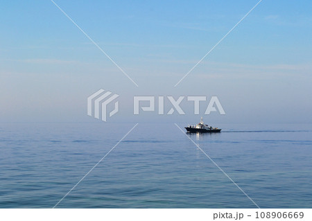 Baltiysk, Kaliningrad region, Baltic spit, ship in the Baltic Sea, water surface to the horizon Baltiysk, Kaliningrad region, Baltic spit, ship in the Baltic Sea, water surface to the horizon 108906669
