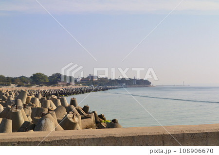 Baltiysk, Kaliningrad region, Northern pier, view of Baltiysk and the monument to Peter, concrete breakwaters Baltiysk, Kaliningrad region, Northern pier, view of Baltiysk and the monument to Peter, concrete breakwaters 108906670