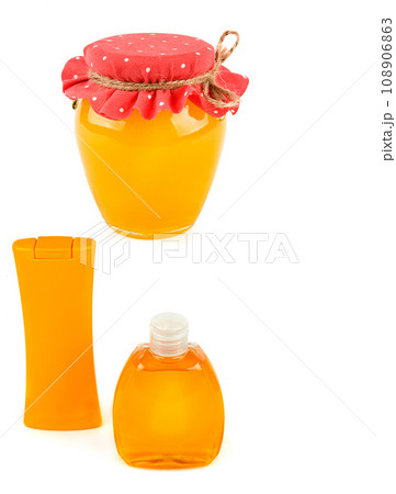 Bottles with shampoo and shower gel, a jar of honey isolated on a white background. Vertical photo. Collage. Free space for text. Bottles with shampoo and shower gel, a jar of honey isolated on a white background. Vertical photo. Collage. Free space for text. 108906863