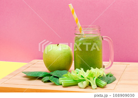 Fresh Green Smoothie of Apple, Celery, and Spinach in Glass Smoothie Jar 108909030
