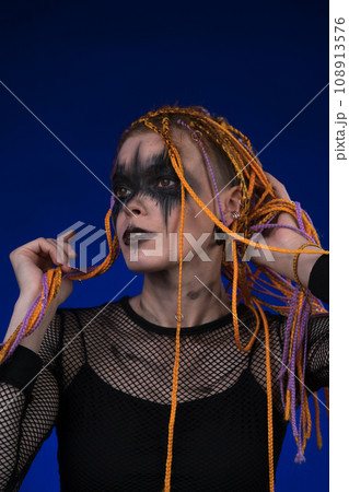 Cinematic portrait of woman with horror stage make-up and without dangerous dreadlocks hairstyle Cinematic portrait of woman with horror stage make-up and without dangerous dreadlocks hairstyle 108913576
