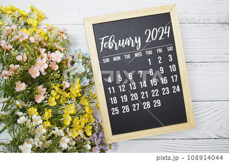 February 2024 monthly calendar with flower bouquet decoration on wooden background February 2024 monthly calendar with flower bouquet decoration on wooden background 108914044