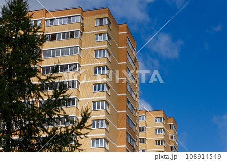 new high rise brick apartment buildings with spruce tree new high rise brick apartment buildings with spruce tree 108914549