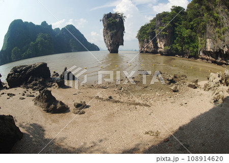 Tropical limestone island on a sunny day in Thailand. Tropical limestone island on a sunny day in Thailand. 108914620