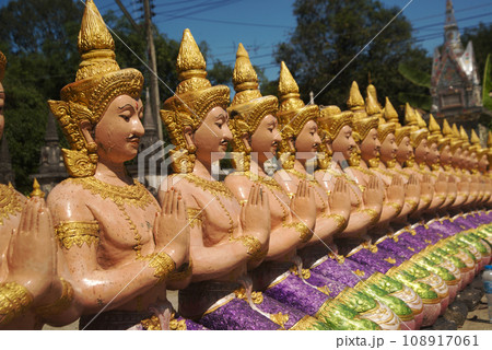Statues of angels lined up in rows, beautiful, guarding and decorating the place at Wat Maneewong Temple. This is a travel to pay homage for sacred thing. Statues of angels lined up in rows, beautiful, guarding and decorating the place at Wat Maneewong Temple. This is a travel to pay homage for sacred thing. 108917061