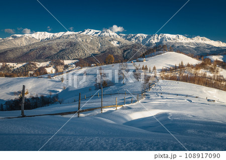 Winter scenery with fresh snowy slopes and high mountains, Romania Winter scenery with fresh snowy slopes and high mountains, Romania 108917090