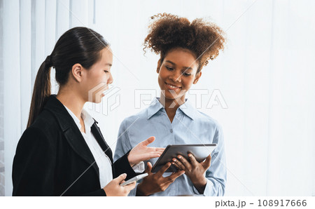 Modern multicultural office worker in corporate workplace wiht tablet. Concord 108917666