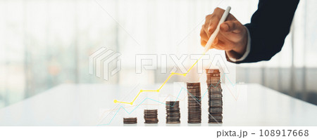 Coin stack with digital graphic indicator symbolize business investment. Shrewd 108917668