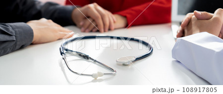 Couple attend fertility consultation with gynecologist at hospital. Rigid Couple attend fertility consultation with gynecologist at hospital. Rigid 108917805