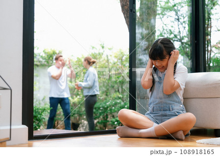 Stressed and unhappy young girl hide from domestic violence at home. Synchronos 108918165