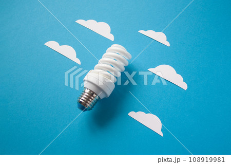 Light bulb with white cut out clouds. Idea concept Light bulb with white cut out clouds. Idea concept 108919981