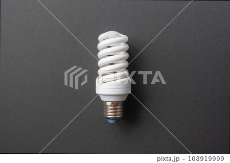 Energy saving light bulb on a black background 108919999