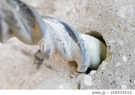 Stone drilling bit and concrete wall Stone drilling bit and concrete wall 108924818