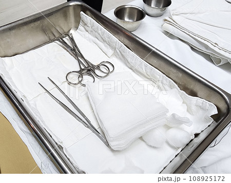 Set of surgical instruments on a hospital table 108925172