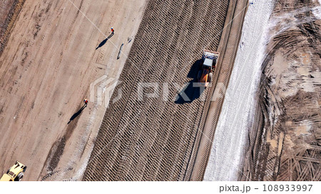 heavy construction equipment on a construction site 108933997