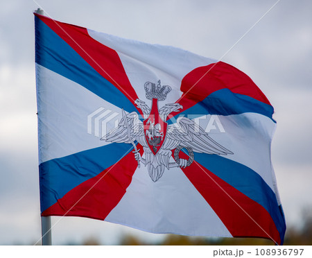 The flag of the Ministry of Defense of the Russian Federation is flying in the wind against a cloudy sky. The flag of the Ministry of Defense of the Russian Federation is flying in the wind against a cloudy sky. 108936797